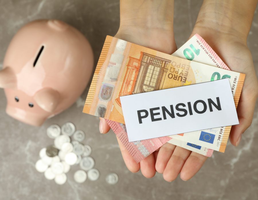 Concept of pension or retirement plan on gray table